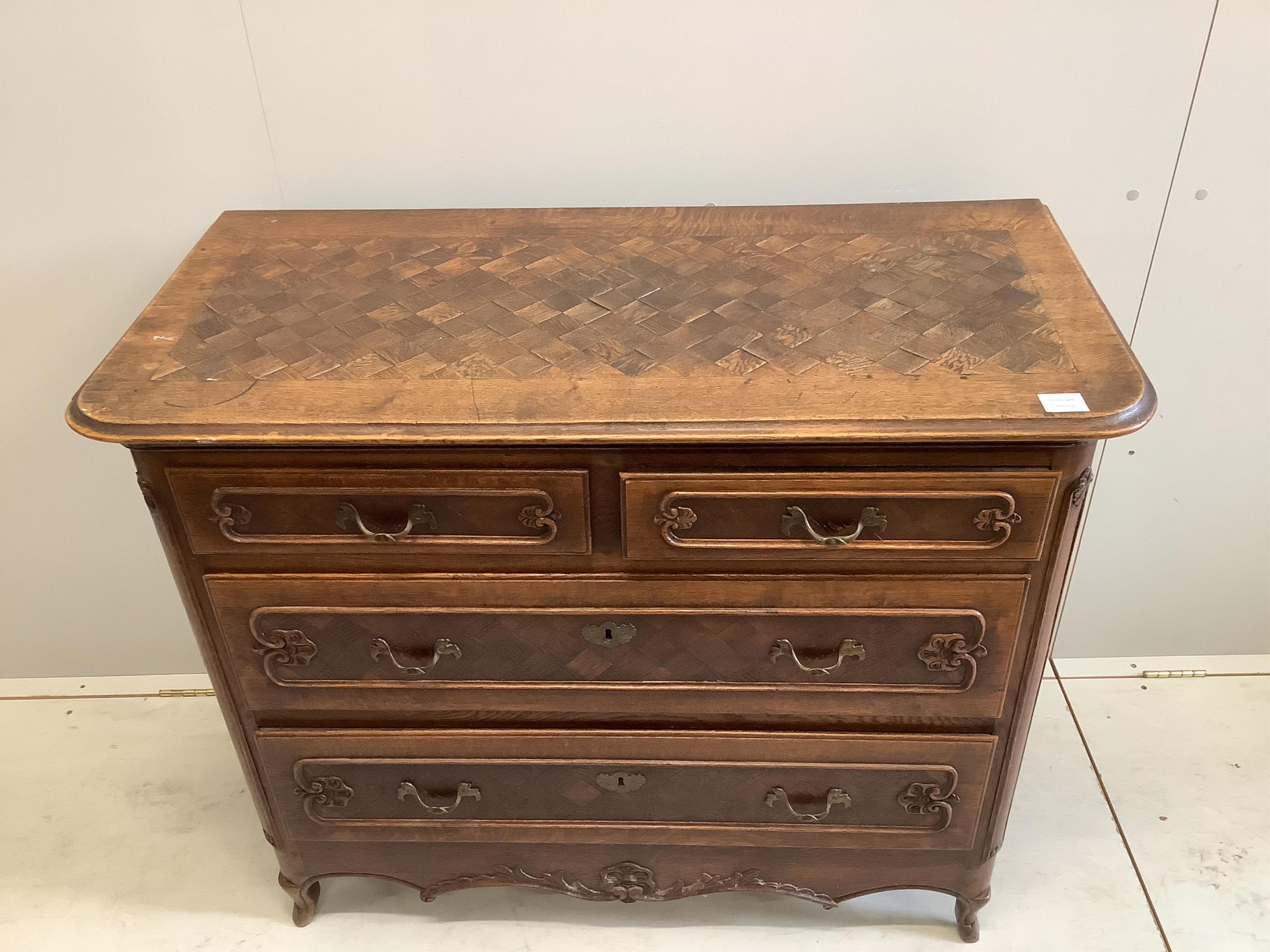 An early 18th century French oak and parquetry commode, width 110cm, depth 52cm, height 92cm
